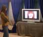 Episode 4: Adrianne looking at herself in the commercial they shot